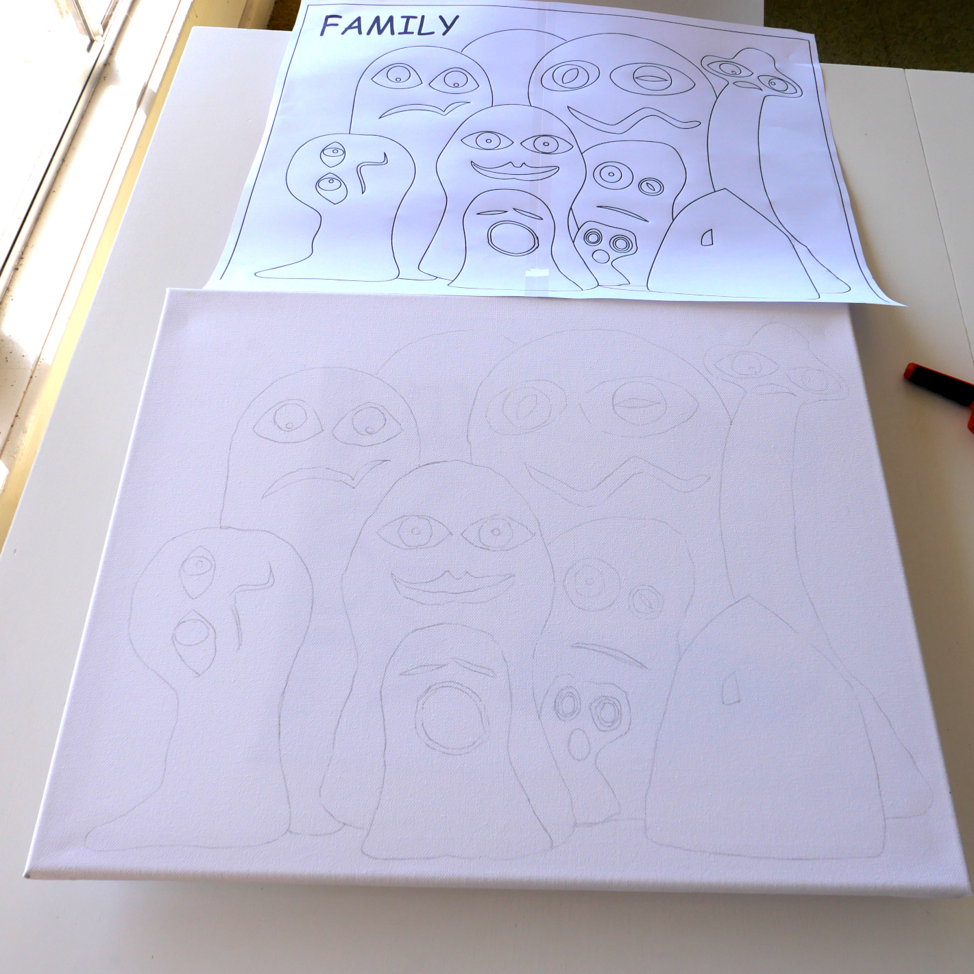 The 'Family' concept traced onto a canvas ready for painting.